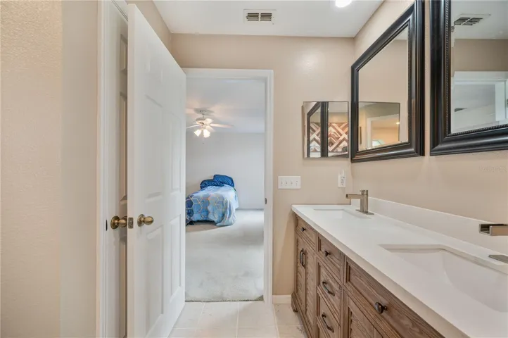 Primary bedroom ensuite with walk in shower and dual vanities!