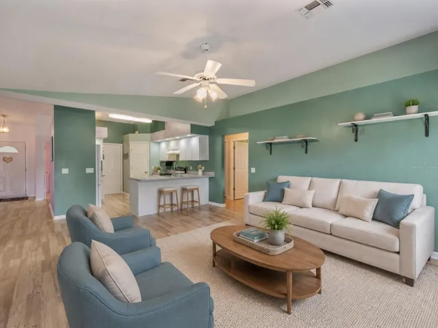 Family Room opened to the kitchen - Virtually Staged to enhance experience.