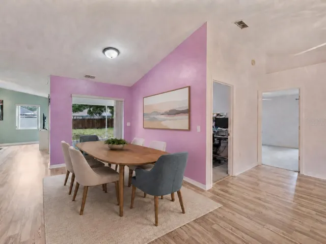 Dining area, open ip to the lanai - Virtually Staged to enhance experience.
