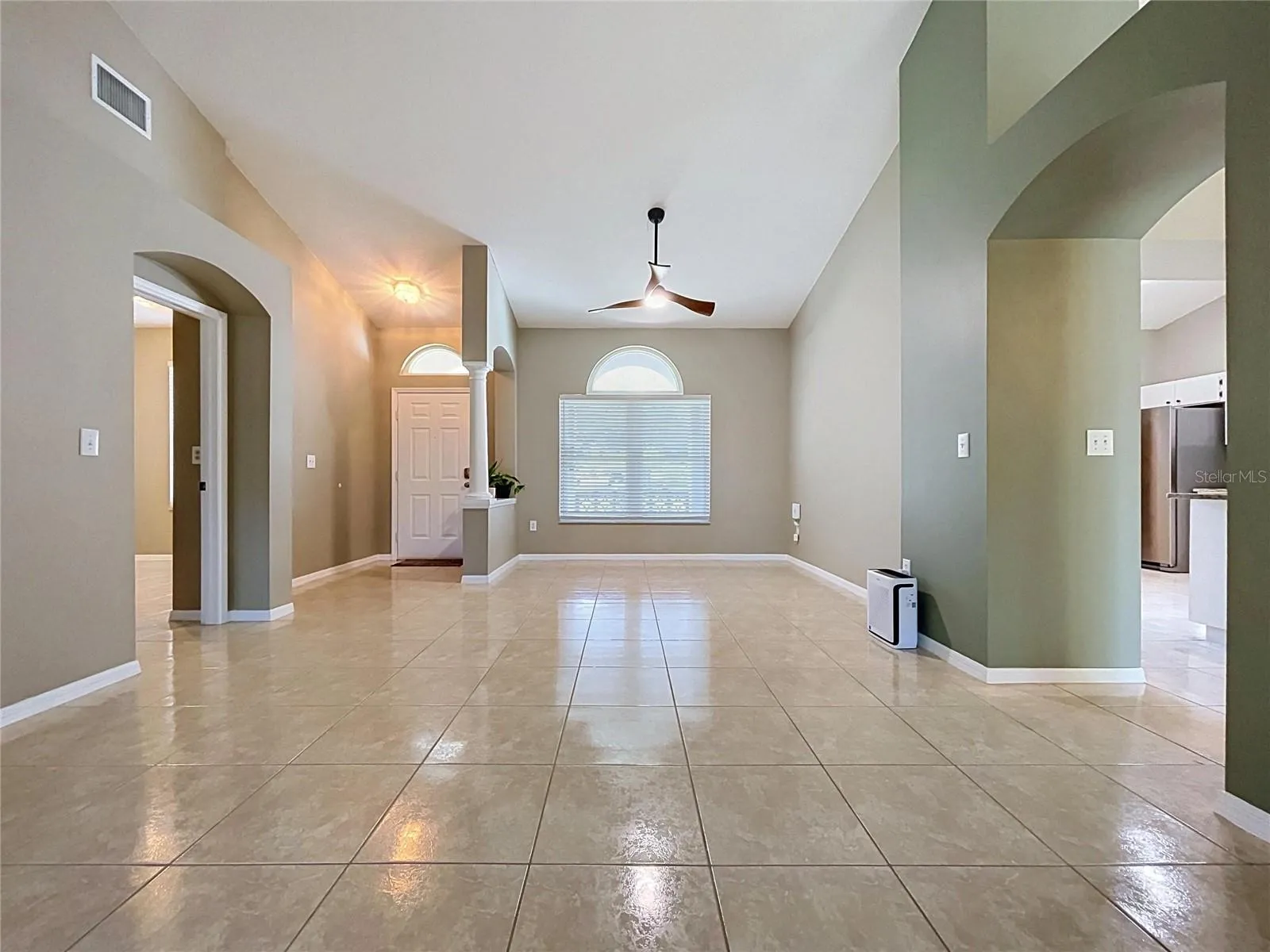 Dining Room and Living Room. Entrance to bedroom #2 to the left.