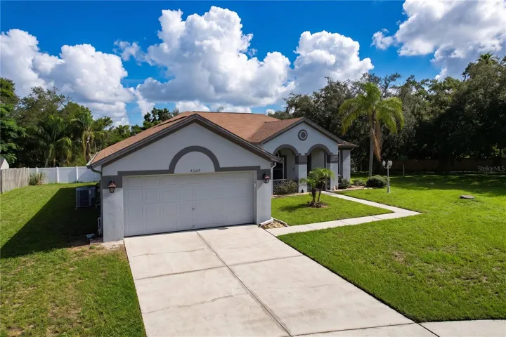 Front of home with large side yard