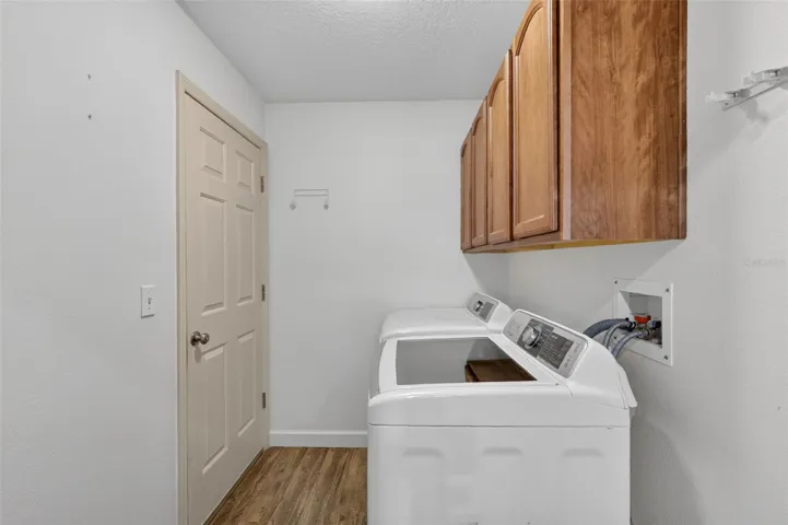 laundry room with cabinets