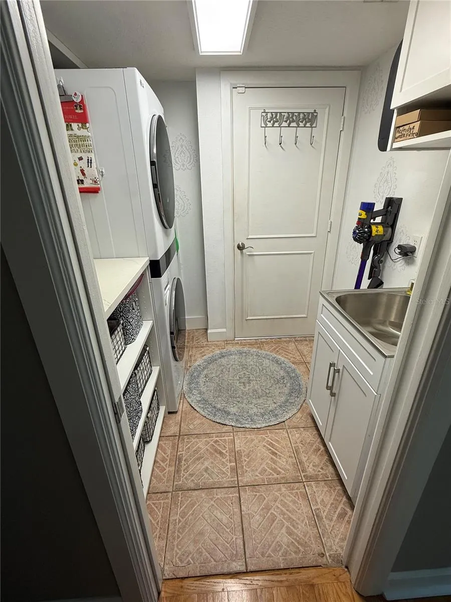 Laundry Room LG Tower, vanity and with utility sink