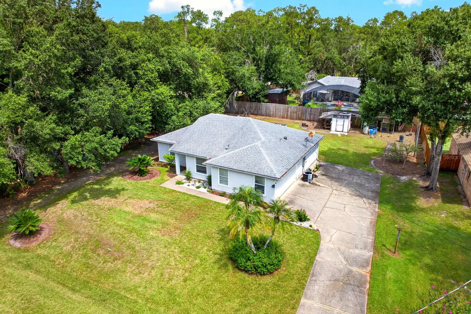 Tucked away near beautiful Lake Mary Jane, this charming 3BD/2BA single-story home offers the space, privacy and NATURAL SETTING so many buyers are looking for, all on an OVERSIZED LOT—well over a quarter acre, surrounded by mature landscaping.