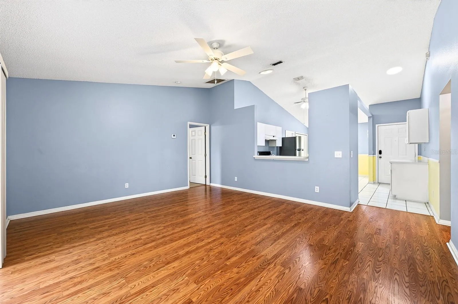 Beautiful LAMINATE FLOORING flows through the Living Room.