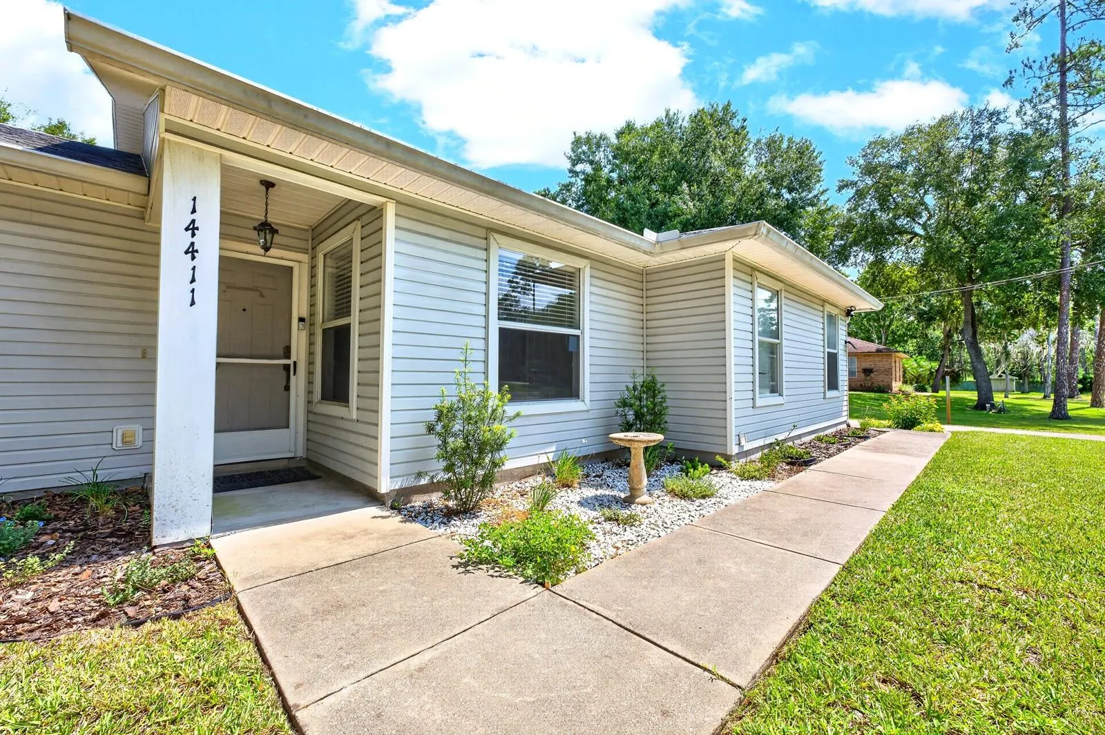 Step inside to a comfortable floor plan with HIGH CEILINGS and a welcoming sense of space.