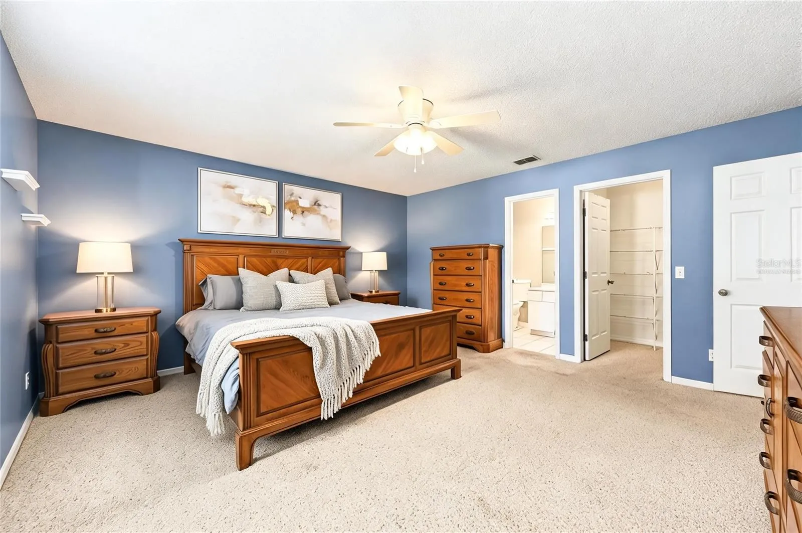 The desirable SPLIT BEDROOM FLOOR PLAN gives the Primary Suite its own private space on one side of the home and features a WALK-IN CLOSET and private en-suite bath. Virtually Staged