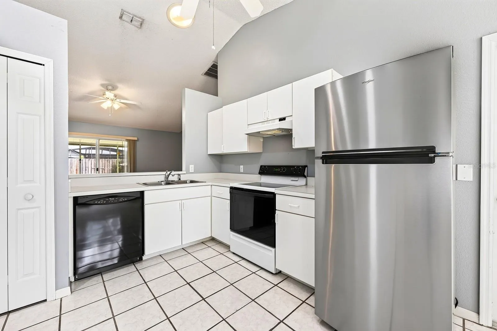 From the Kitchen, enjoy open sight lines into the Living Room.