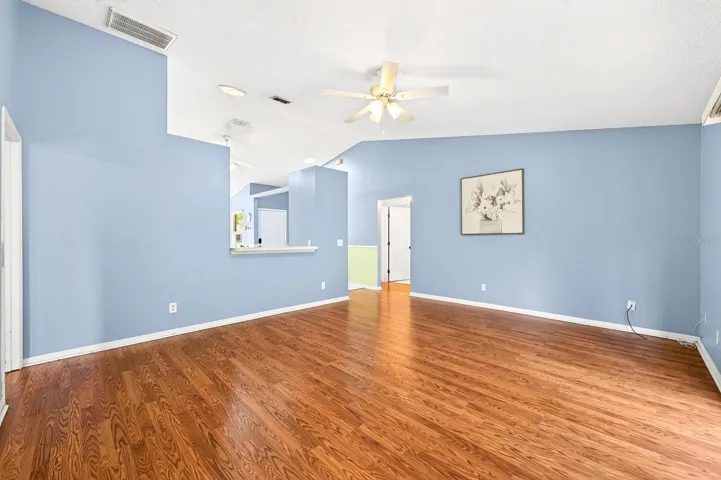 Beautiful LAMINATE FLOORING flows through the Living Room.