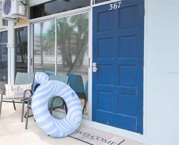 Front door, parking spaces close by out front.