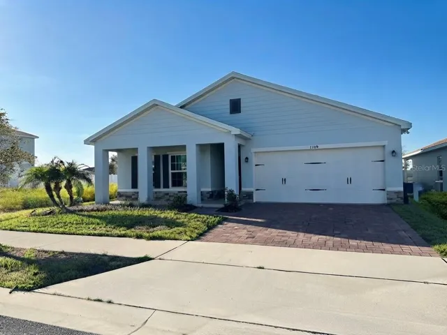 Front. Brick Pavers and 2 Car Garage