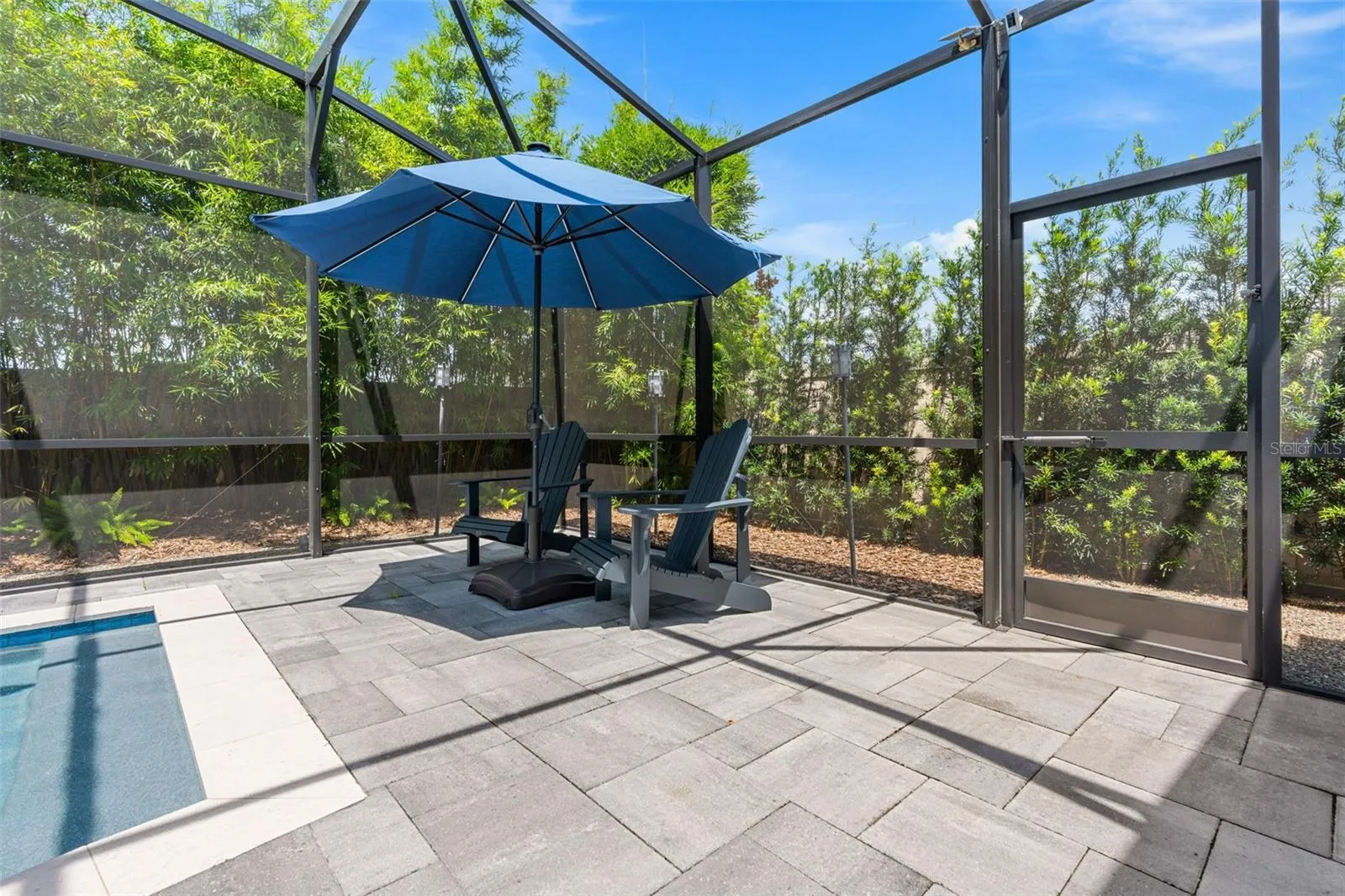 There are mutiple areas to relax or entertain poolside.