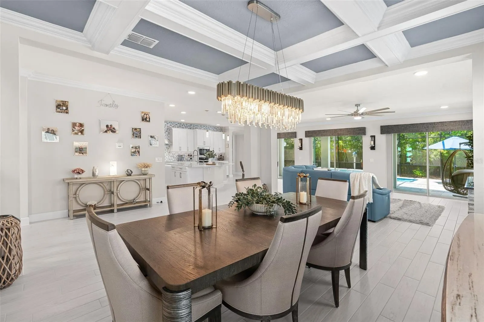 Formal dining area features a beauitful coffered ceiling.