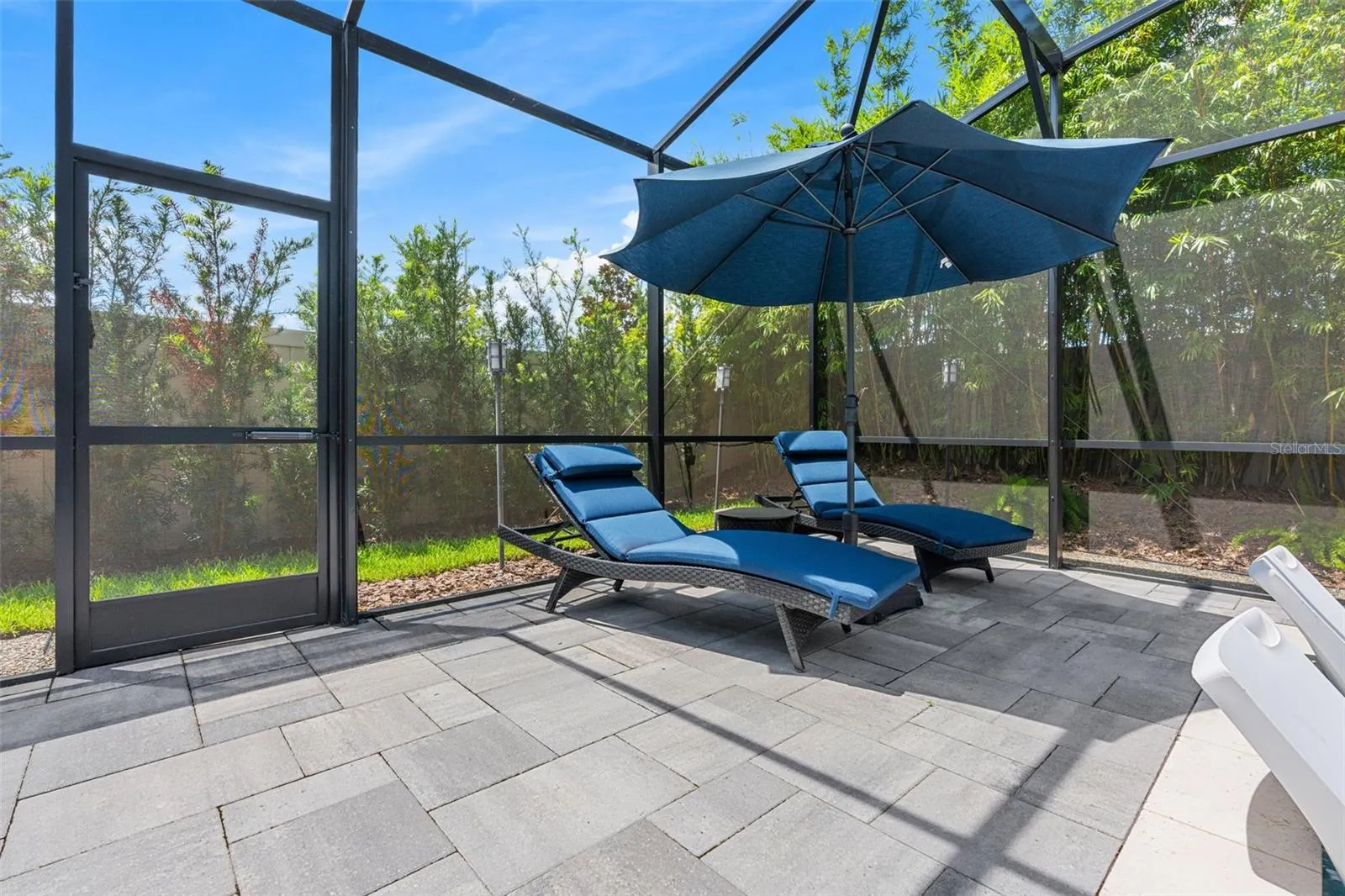 There are mutiple areas to relax or entertain poolside.