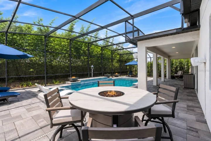 There are mutiple areas to relax or entertain poolside.