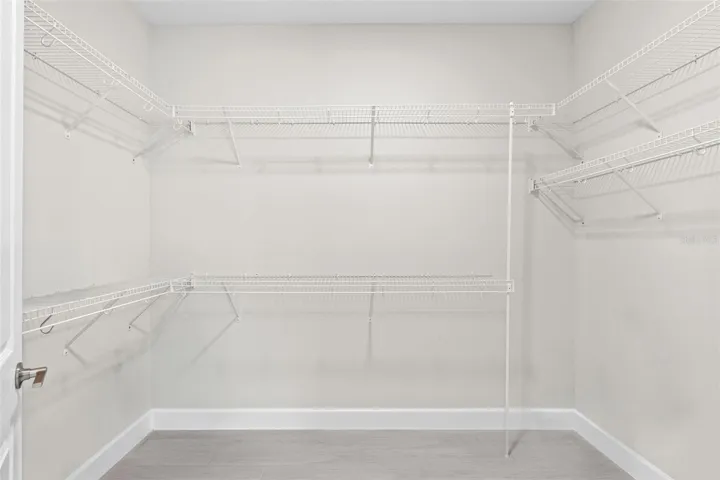 One of two walk-in closets in the primary suite.