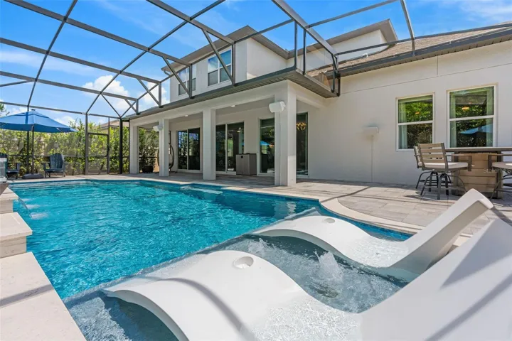 No need to go out, a resort-style retreat is right outside your back door.