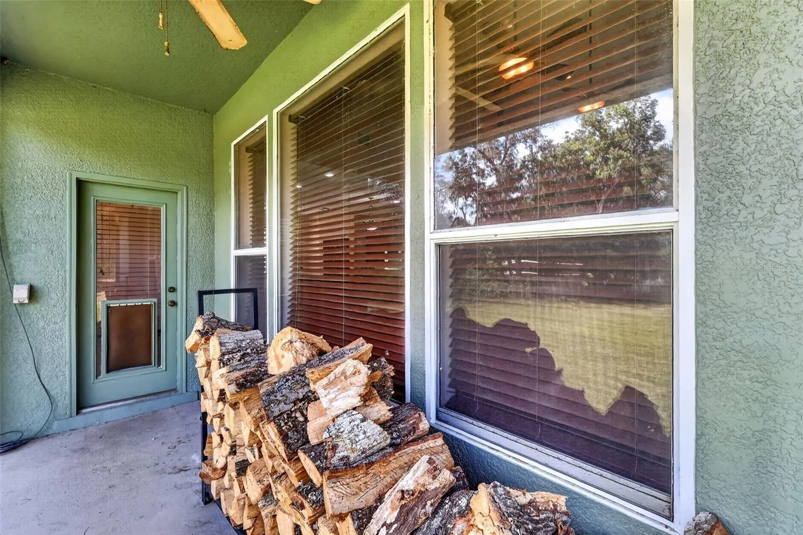 Cozy evenings by the fire start right here, with firewood stacked and ready just steps from the great room's stacked stone fireplace.