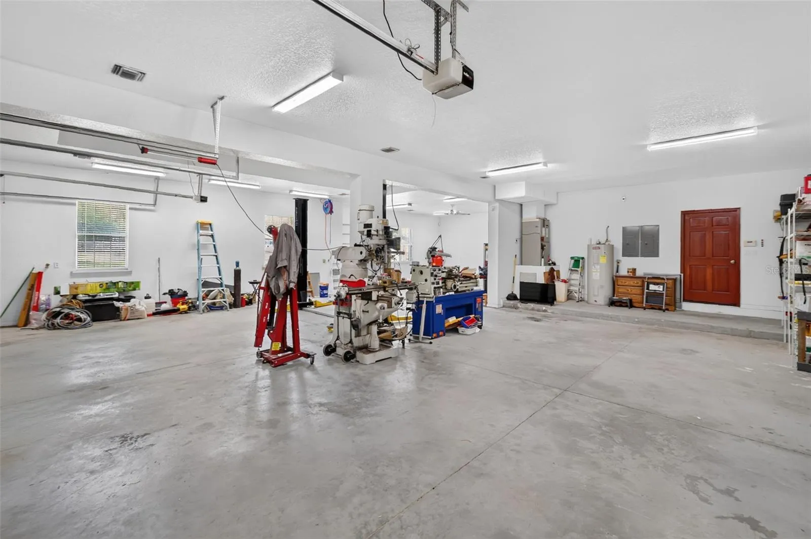 Equipped with heavy-duty power and space for lathes, mills, and more, this is a fully functional shop that most homeowners only dream about.