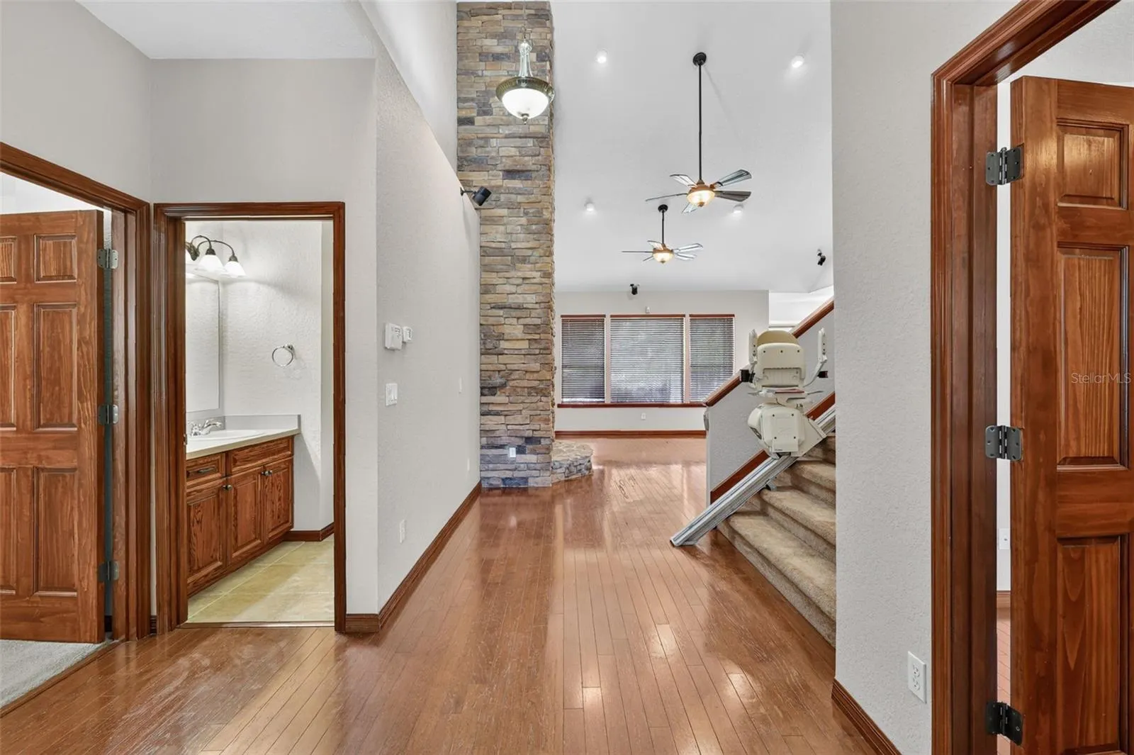 A thoughtfully designed floor plan with easy first-floor access, hardwood floors throughout, and a convenient half bath just steps from the main living area.