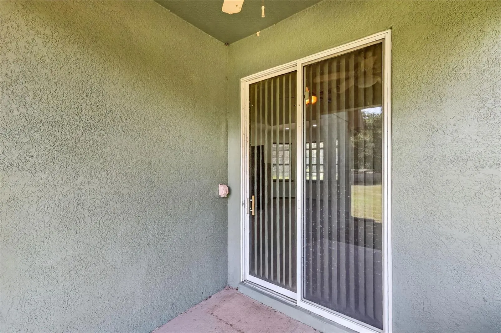 Easy slider access connects the interior living spaces to the outdoor patios on multiple sides of the home.
