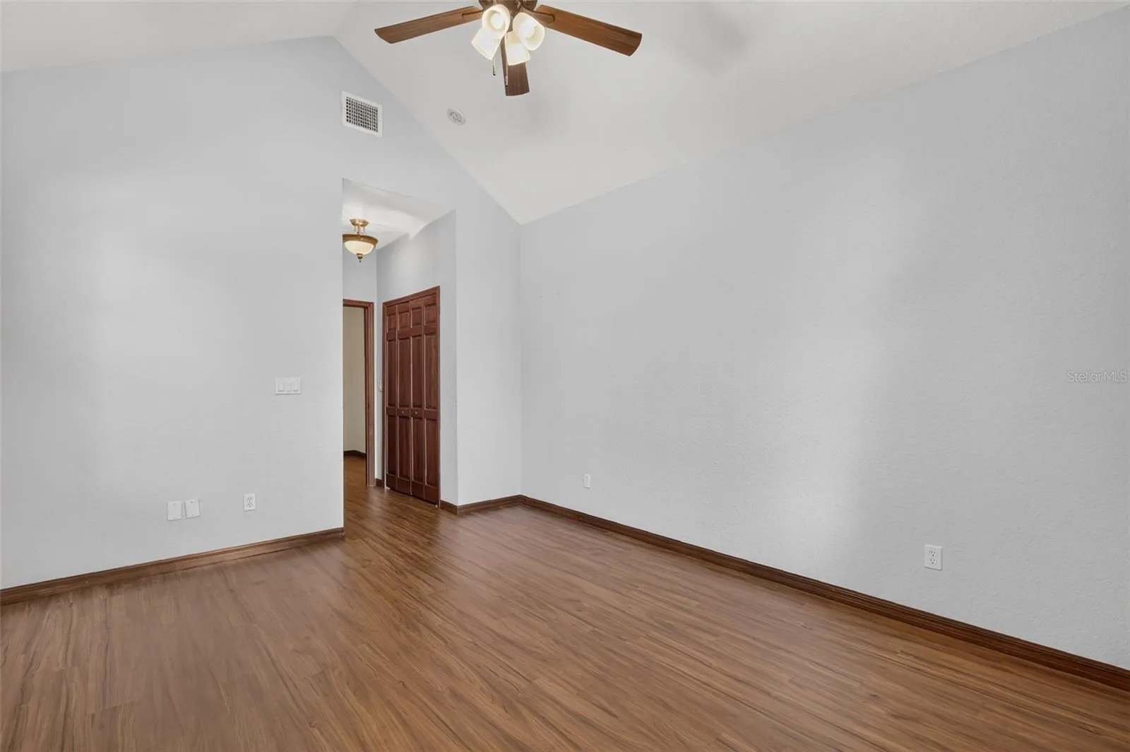 Generous proportions and high ceilings make this secondary bedroom feel anything but secondary.