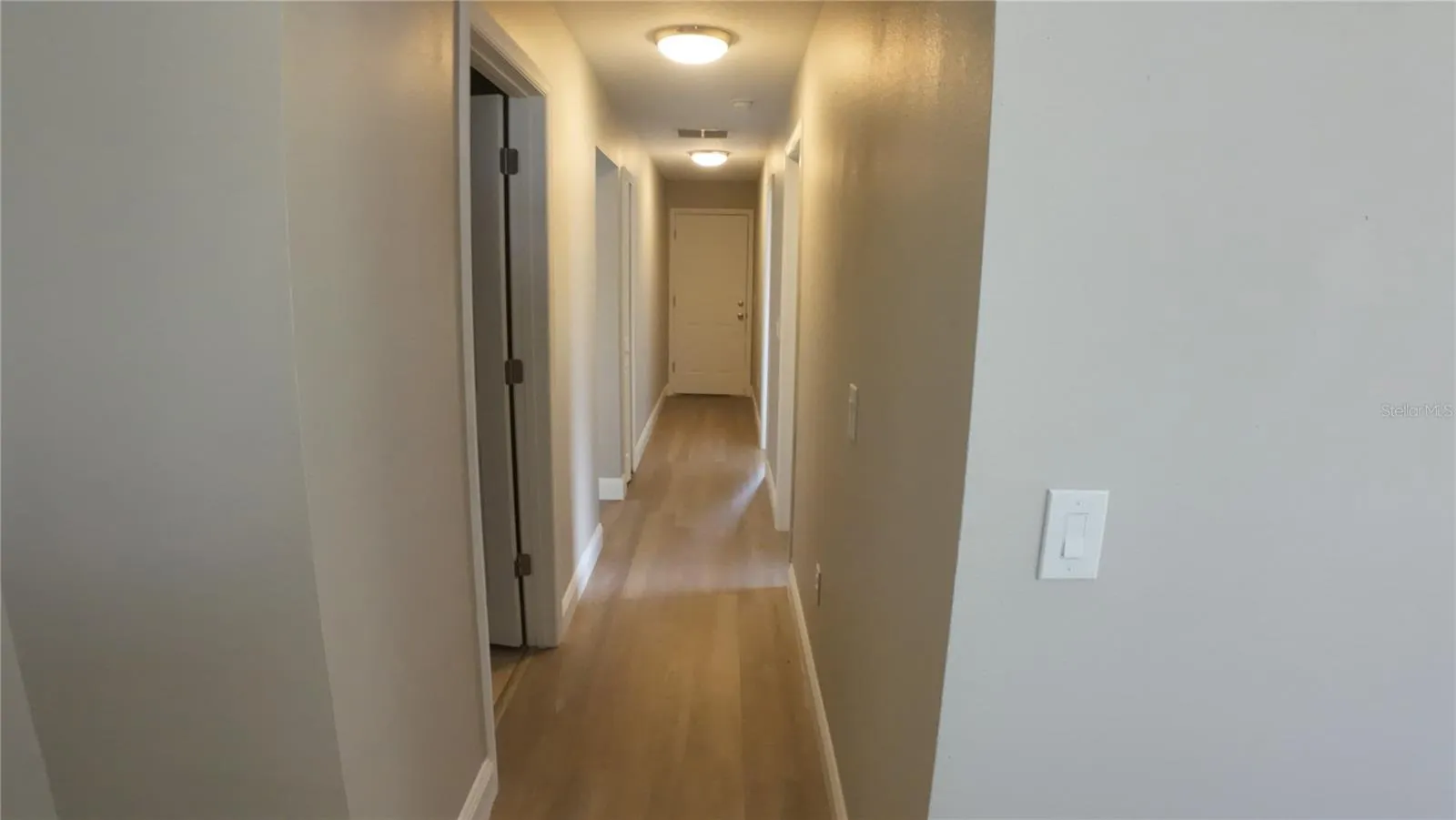corridor with bedrooms on either side