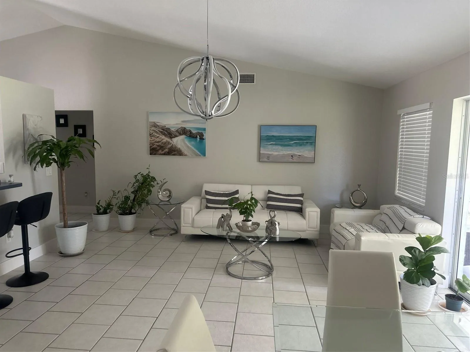 PARTIAL VIEW OF THE FAMILY ROOM FROM EAT IN KITCHEN AREA