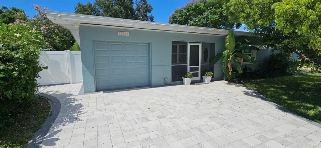 Front of Home with 1 Car Garage Converted to a small garage with