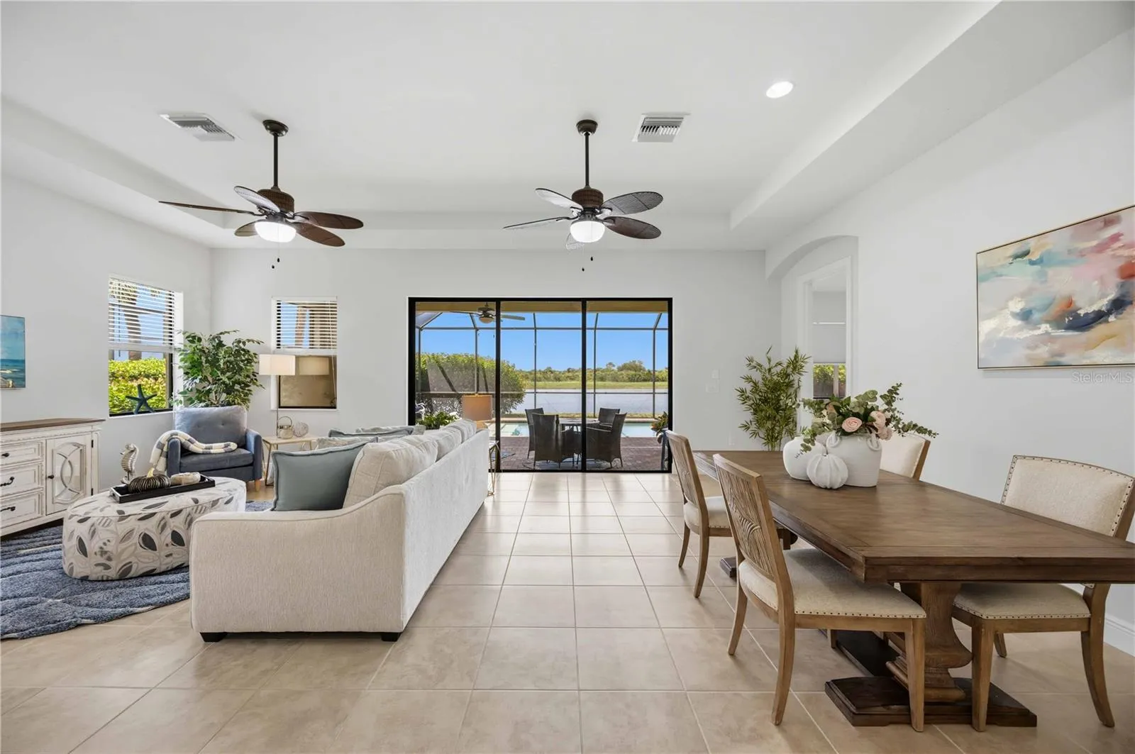 he living /great room in this home shares space with the dining area -