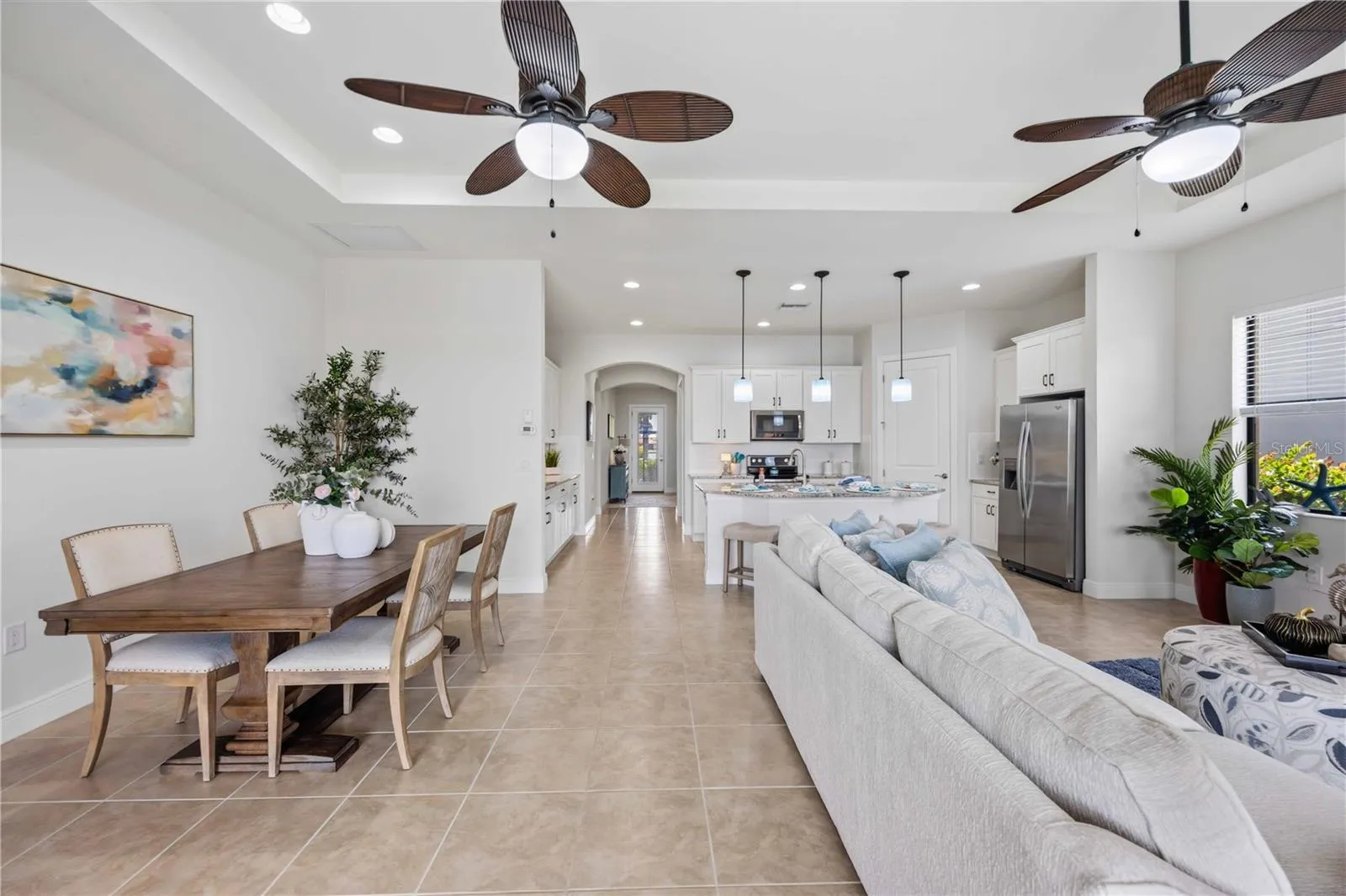 he living /great room in this home shares space with the dining area -