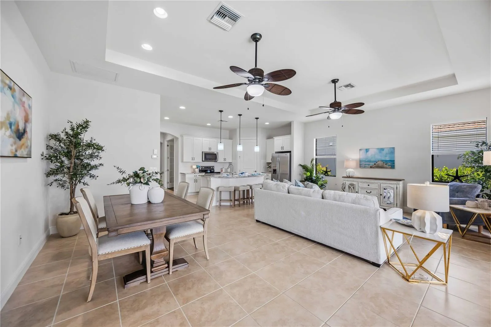 he living /great room in this home shares space with the dining area -