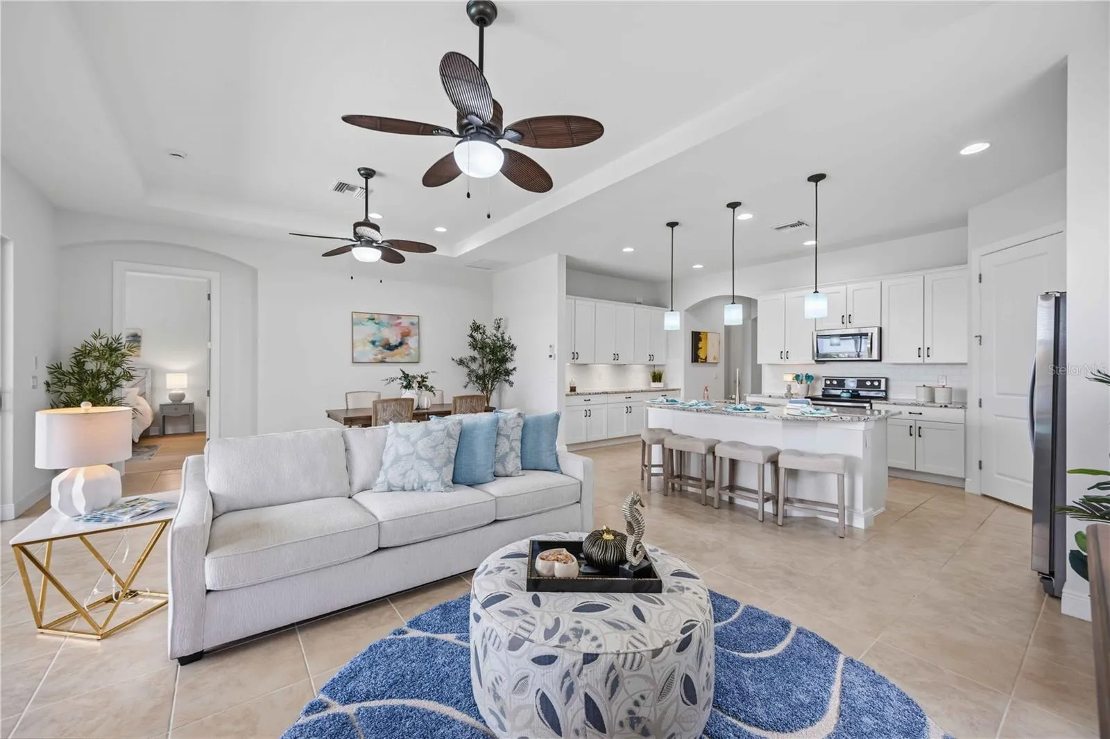 The living /great room in this home shares space with the dining area -