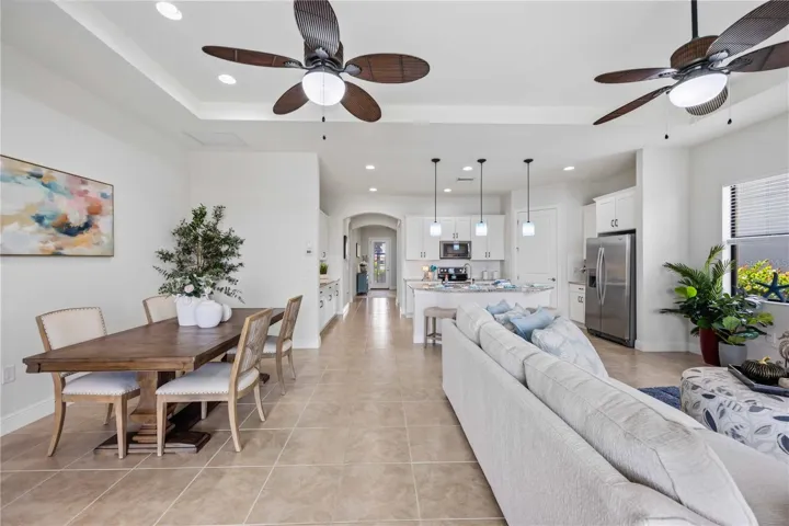 he living /great room in this home shares space with the dining area -