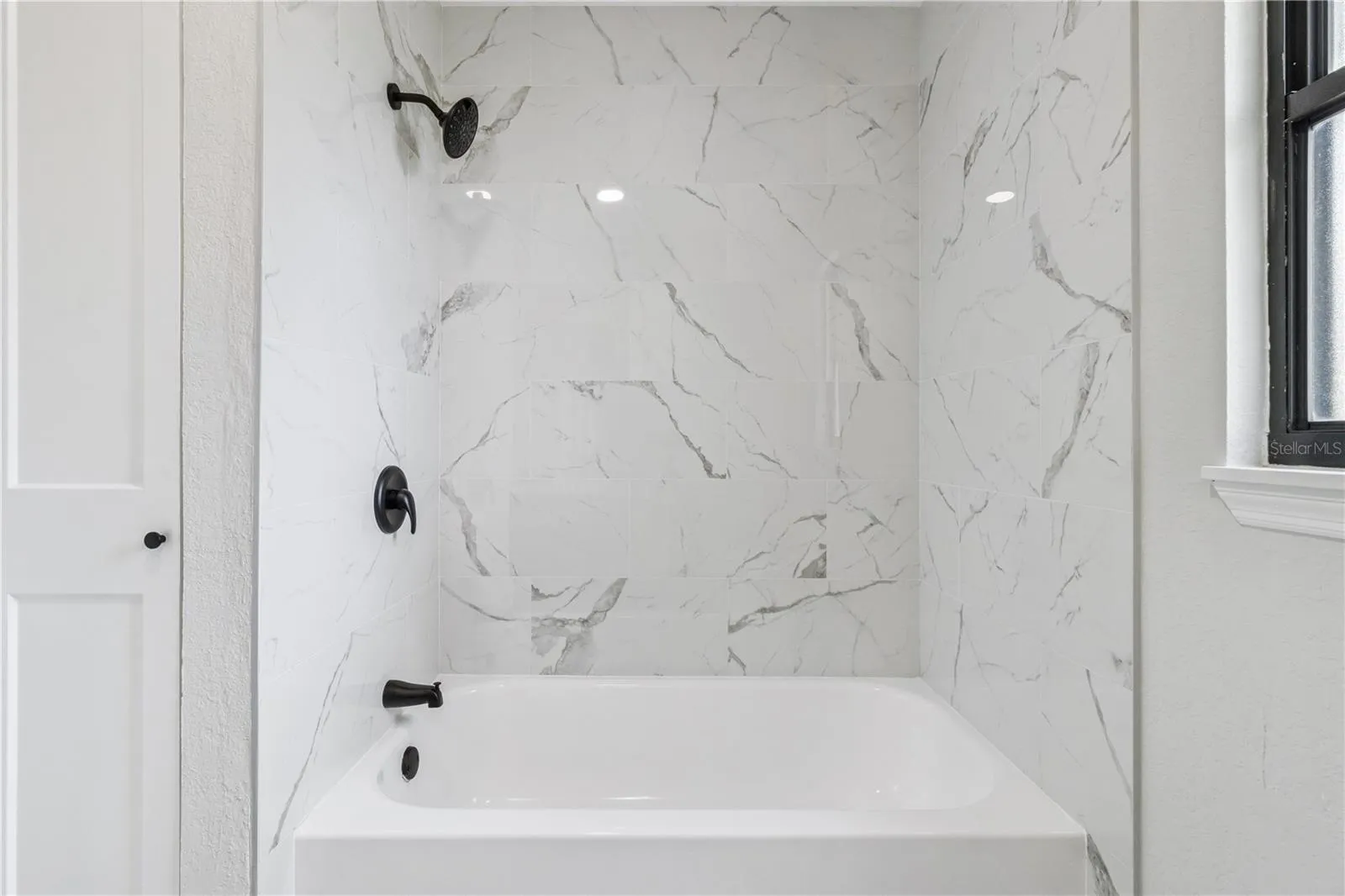Main bathroom with tub and shower