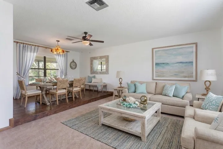 Staged photo of the formal living room and dining room