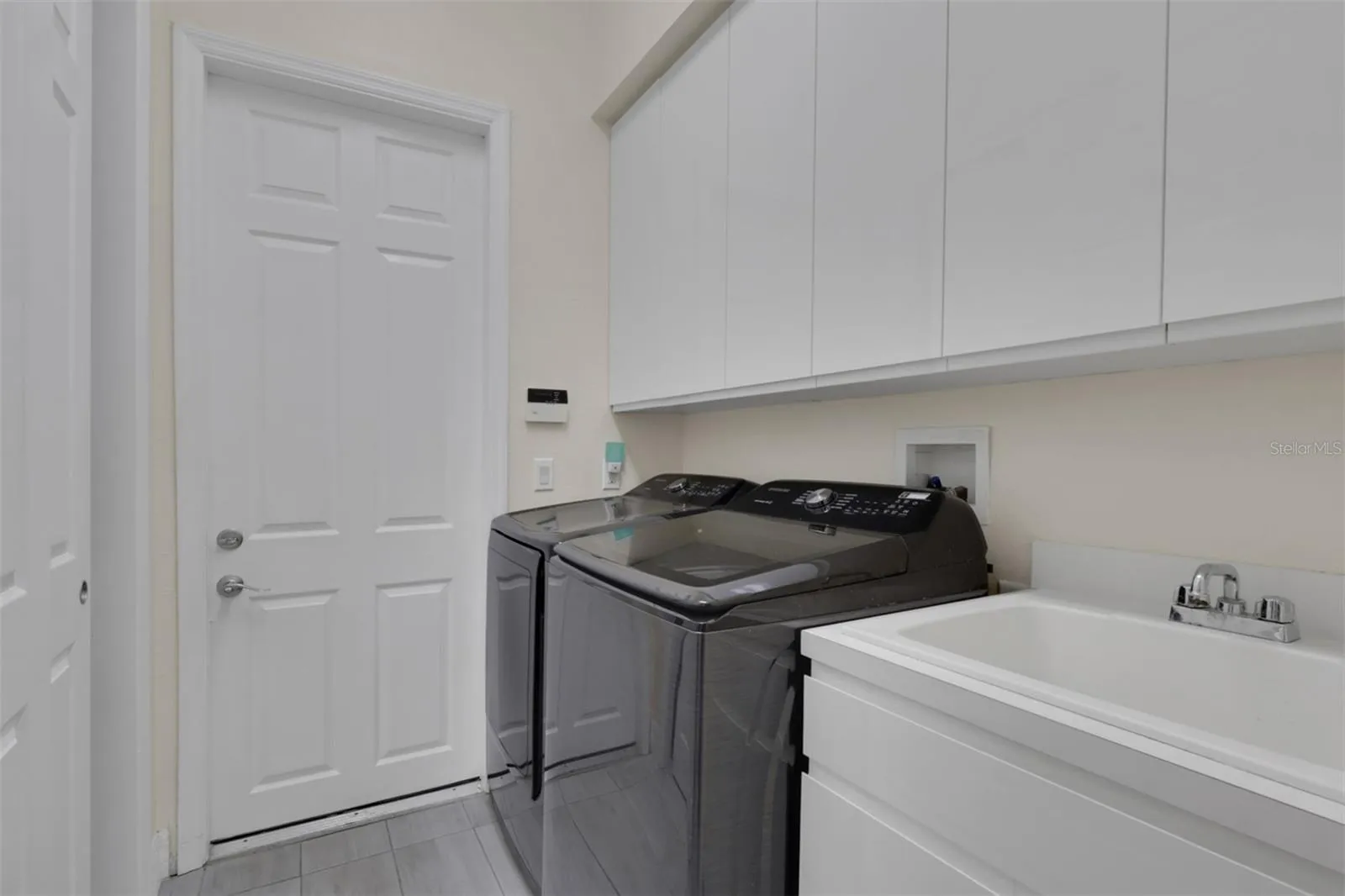 Laundry room with pantry