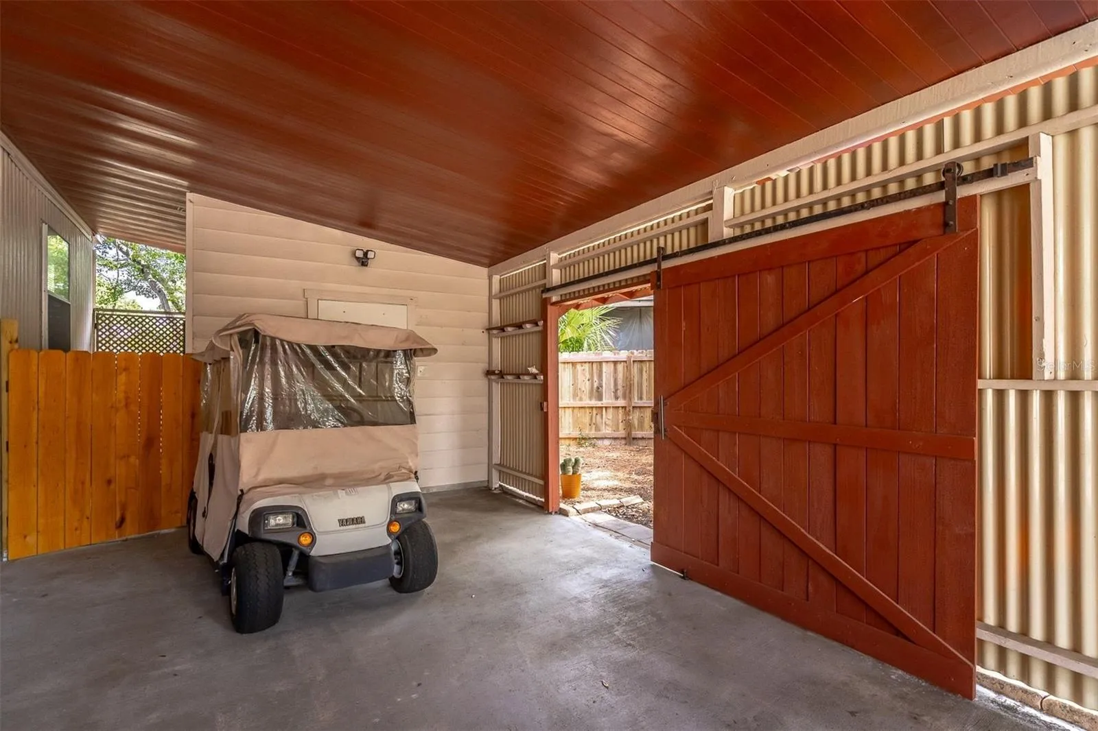 Barn door in carport for privacy