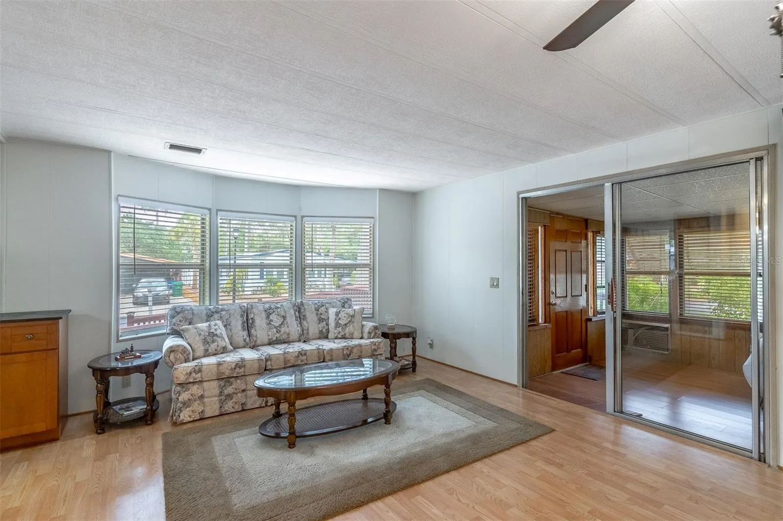 Living room with sliders to florida room