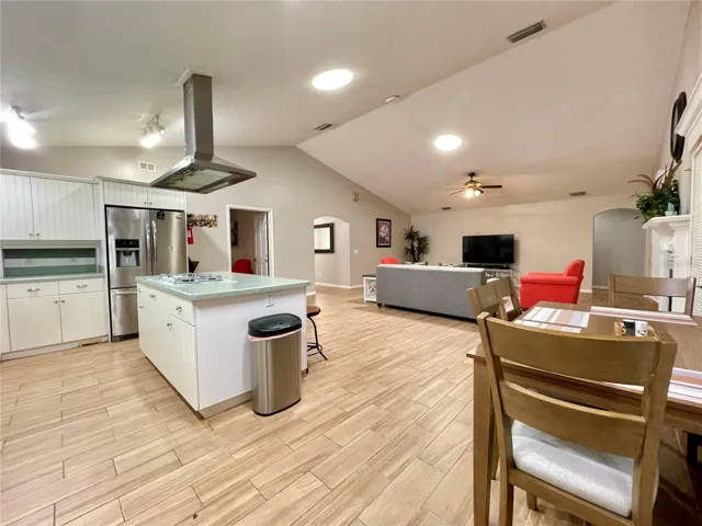 This open perspective showcases the easy connection between the kitchen, dining, and living areas, creating a flexible layout for gathering and entertaining.