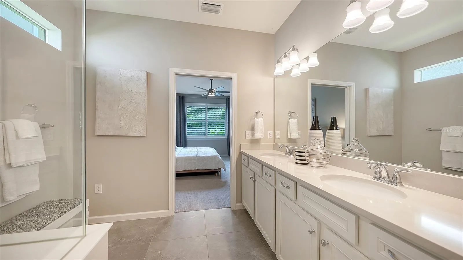 Primary Bath w/Dual Sinks, Step-In Shower, Frameless glass, and Listello Accent Tile
