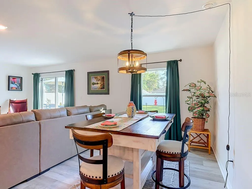 Dining room - luxury vinyl flooring and large windows for natural lighting