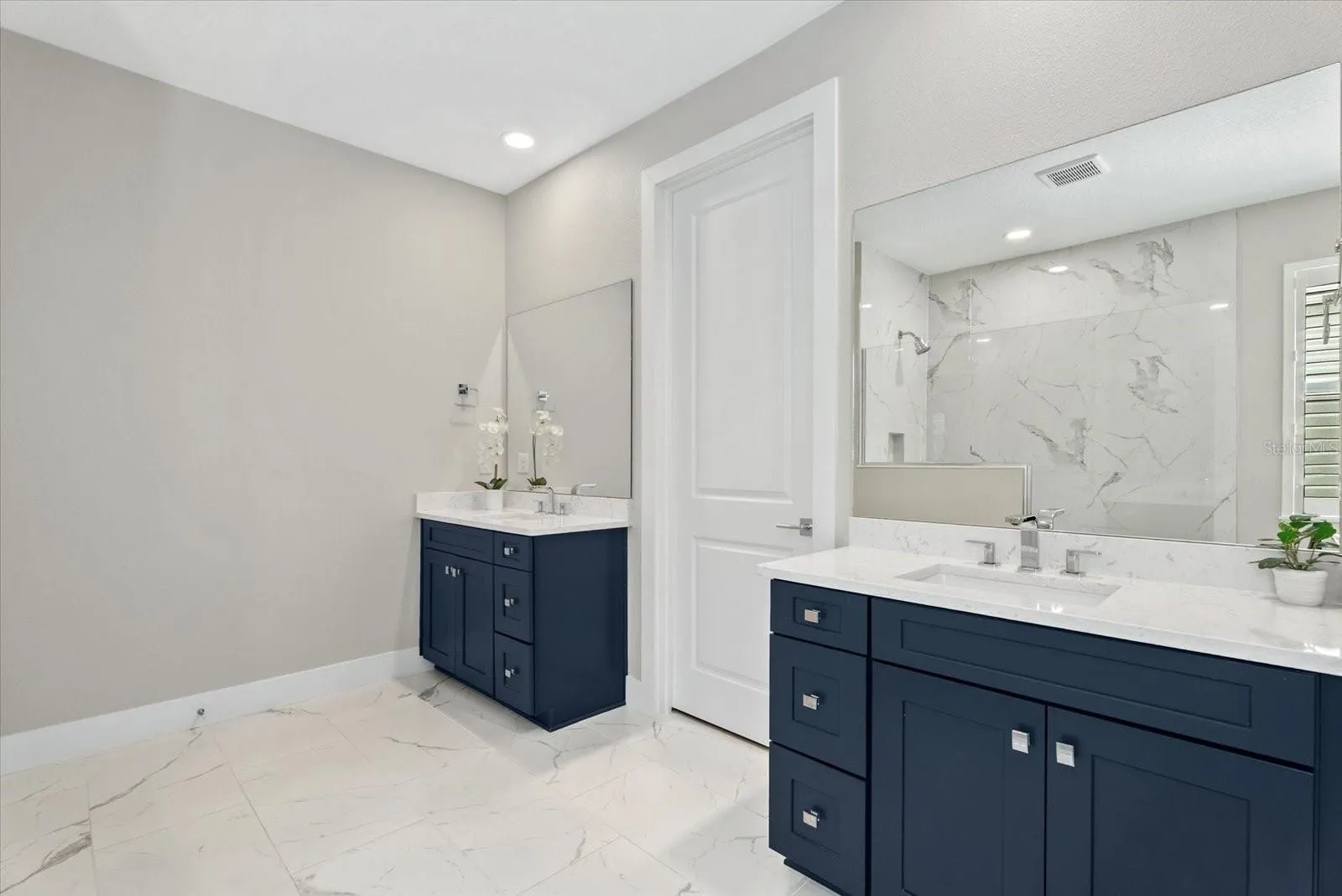 Primary Bathroom with Walk-in Closet and Linen Closet