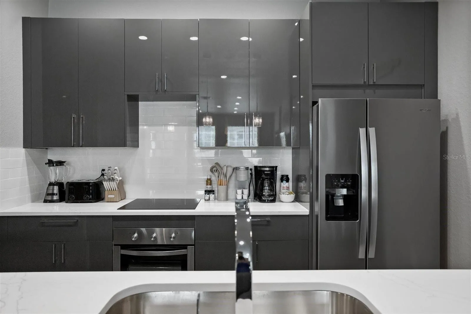 Italian-inspired cabinetry, stainless steel appliances and modern finishes