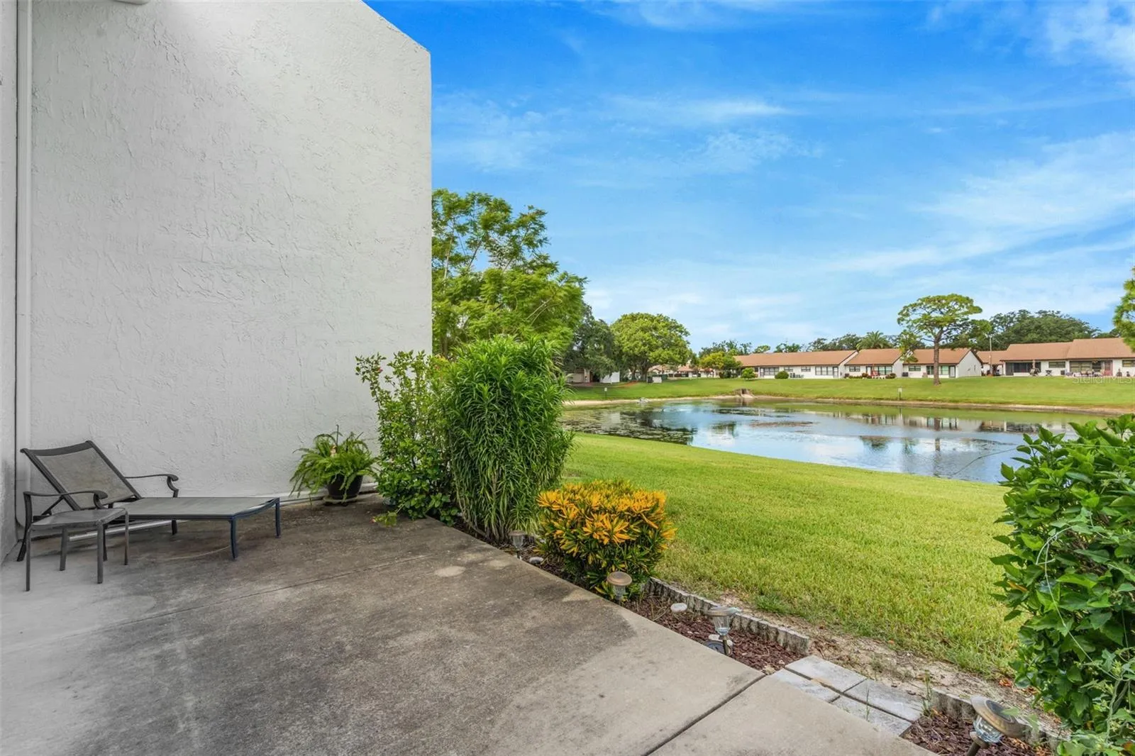 7614 Radcliffe Cir B113 patio and view of pond