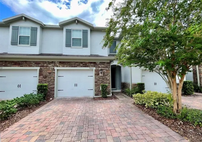 Front of the townhome, showing one car garage.