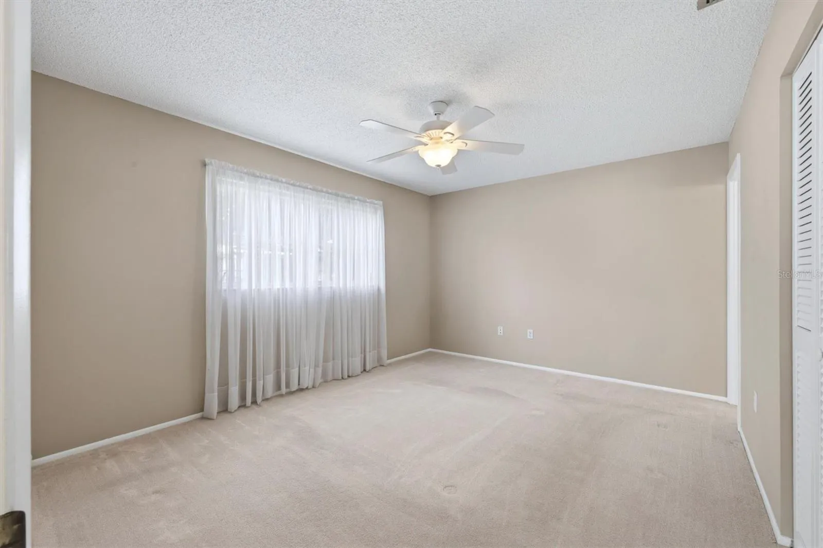 14' x 11' primary bedroom is at back of unit with ensuite Bathroom and large closet