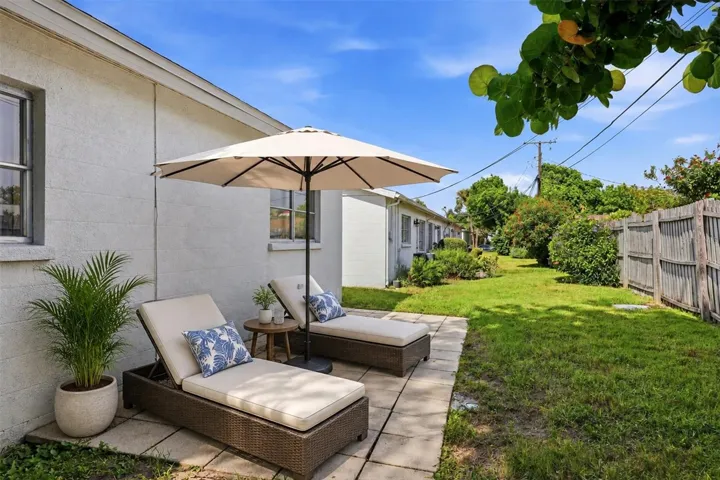 patio behind villa/condo, staged here