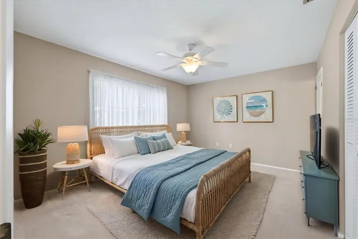 staged primary bedroom has large closet not shown