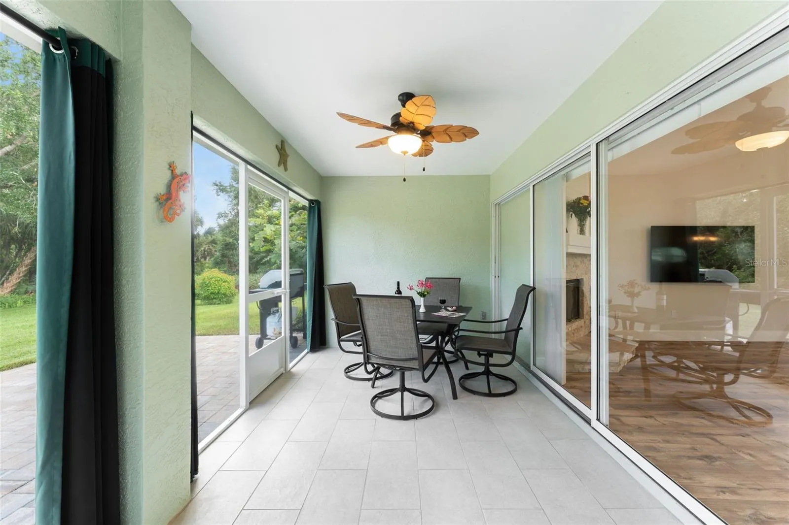 Screened in lanai with collapsing/stacking sliders.